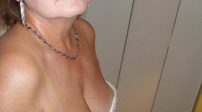 Busty UK granny lets hubby taking some naughty photos wearing sexy lingerie